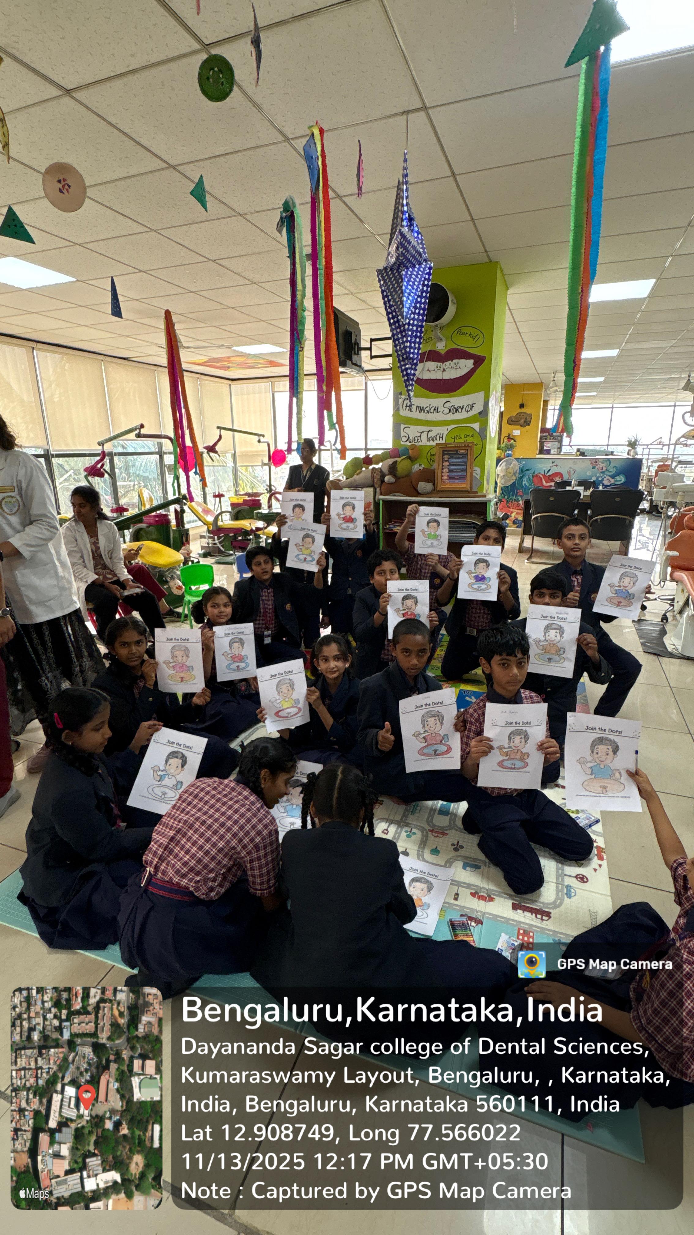 Students holding up oral health education posters
